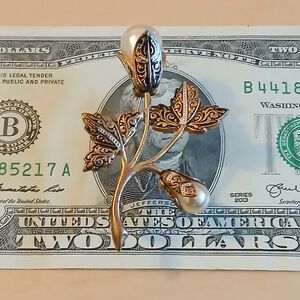 Elegant Gold and Silver Floral Brooch